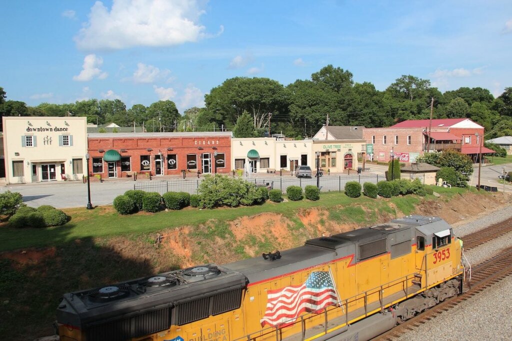 A photo of the train tracks and old shops in downtown Hiram, Georgia