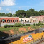 A photo of the train tracks and old shops in downtown Hiram, Georgia