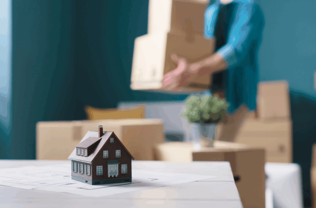 A person packing in order to sell their house and relocate