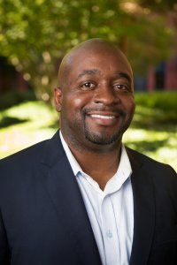 Emeka "Mek", owner of sell your home fast Orlando, smiling in a self portrait