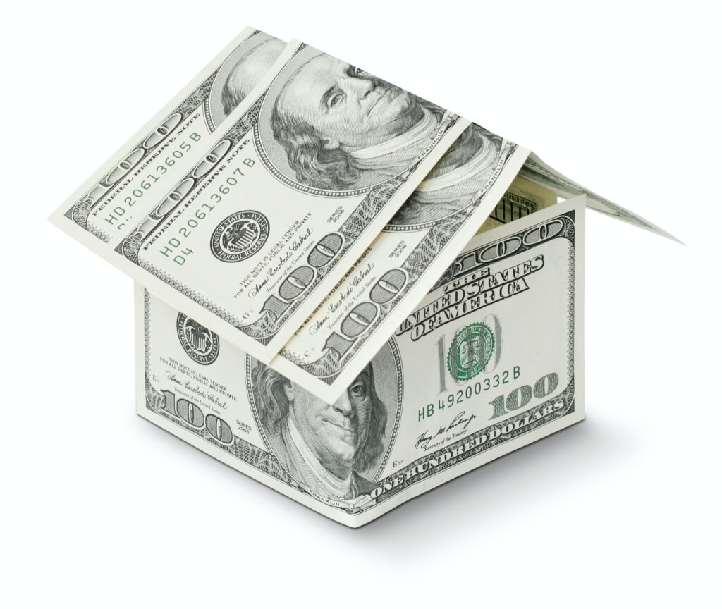 Companies that buy houses for cash. Hundred dollar bills in the shape of a house.