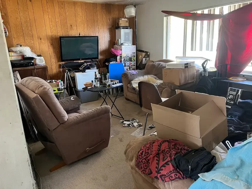Cluttered Kearns Utah home interior — Utah Close Fast buys houses with all belongings left behind, no cleanout required before selling