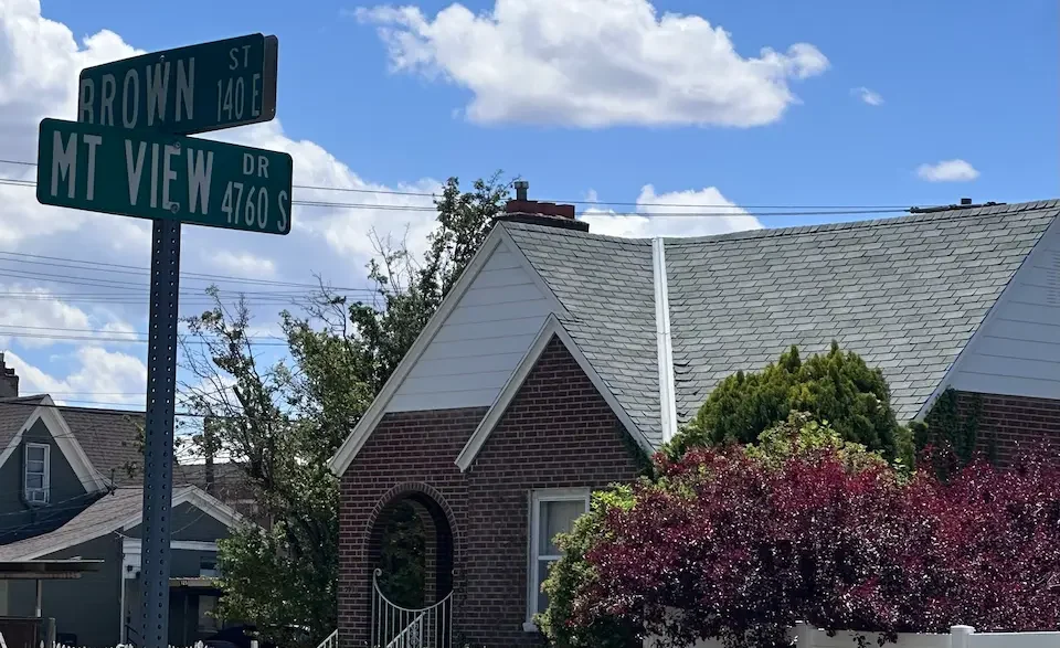 Murray Utah residential neighborhood street corner — local cash home buyers serving Murray neighborhoods since 2015