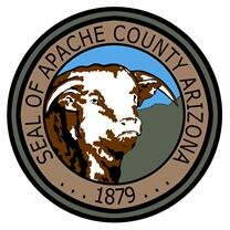 The seal of Apache County Arizona - A circular shape with a cartoonized face of a bull in inner most circle surrounded by the text "Seal of Apache County Arizona" on the top of the circle and "1879" written uunderneath