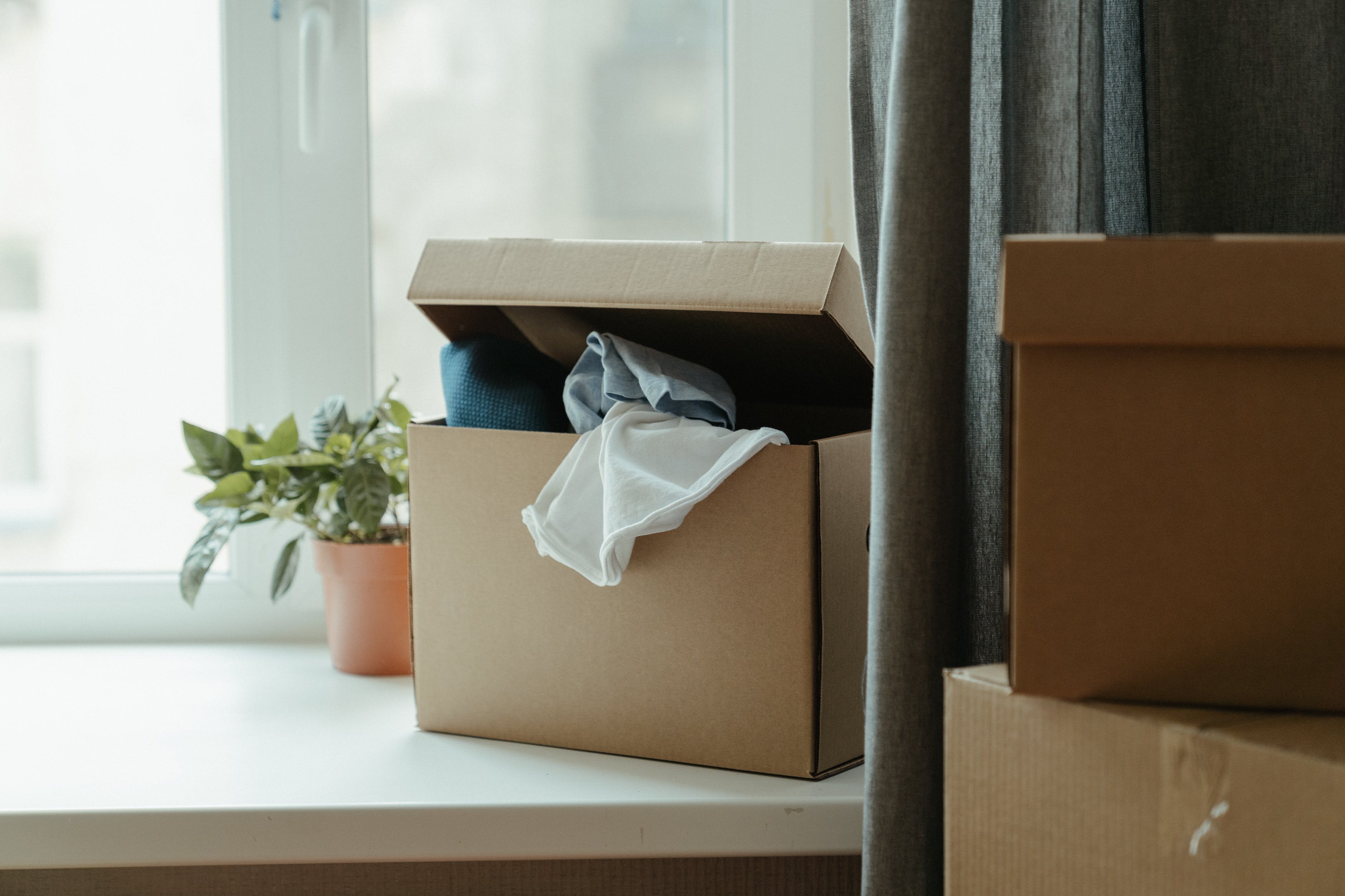 An overflowing box used when downsizing deliberately