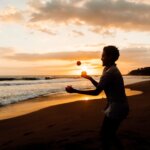 A person juggling, a metaphor for selling a home while managing a corporate relocation