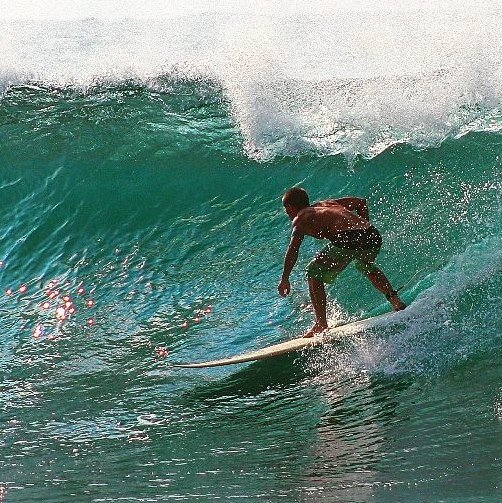 Surfing at Honolua Bay in Maui, Hawaii after finishing work in Lahaina