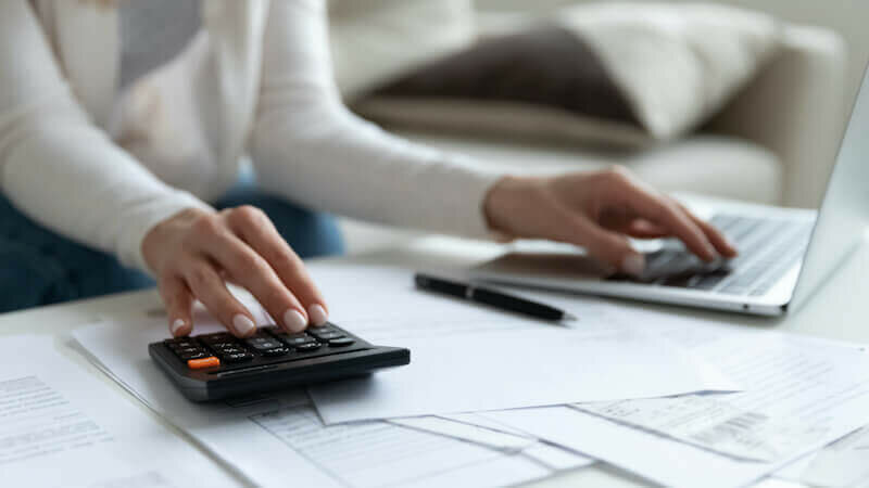 woman calculating Health and Medical Costs