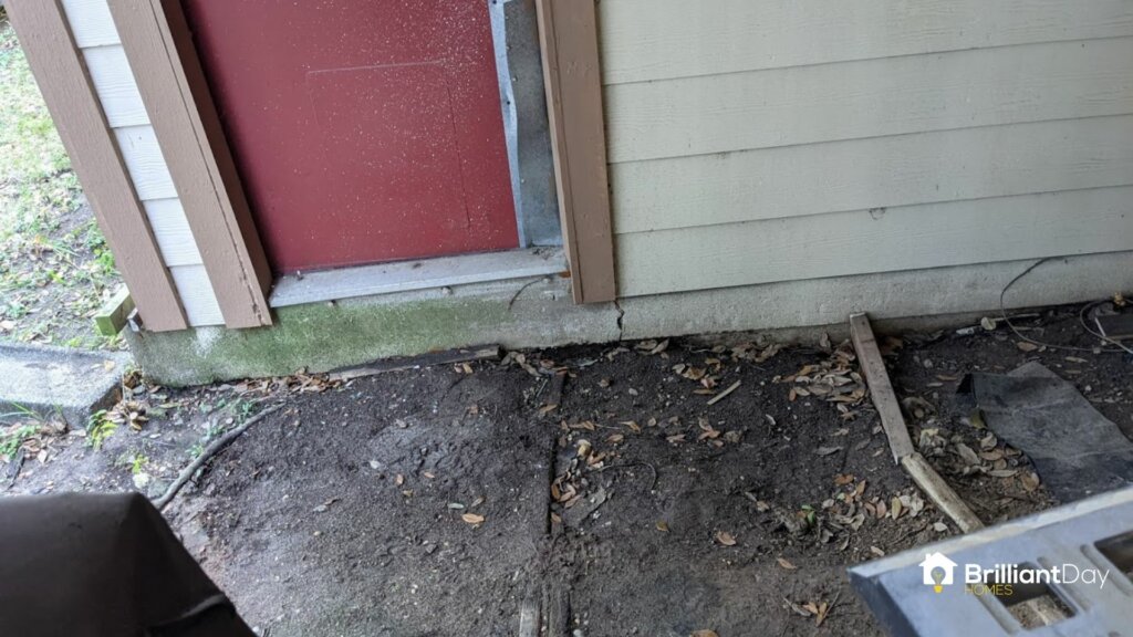 large crack under doorway of house