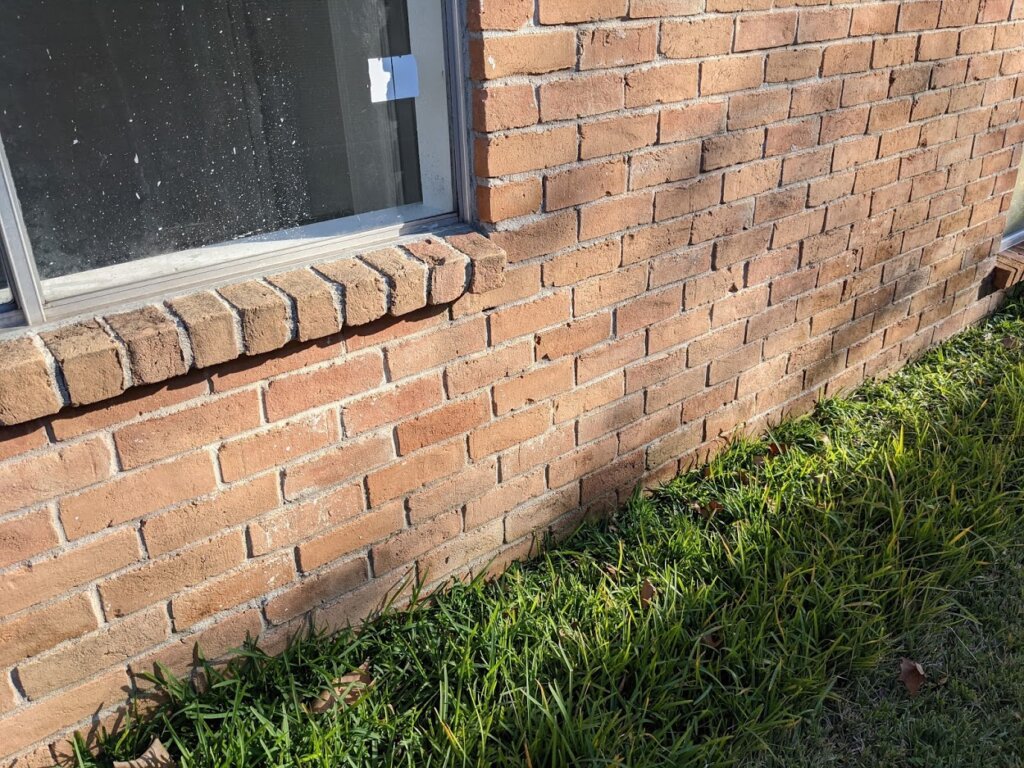 soil is sloping toward the house above the foundation