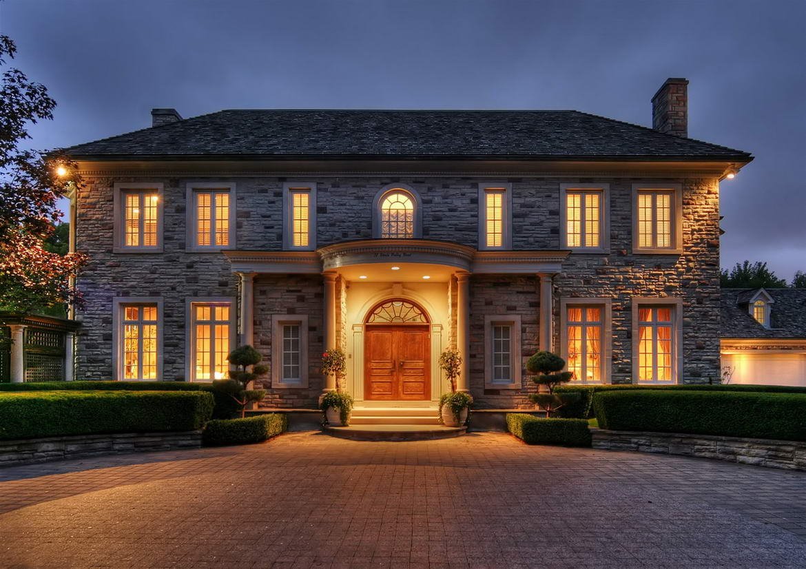 View of the front of big brick house from driveway