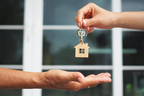 homeseller giving house keys to buyer