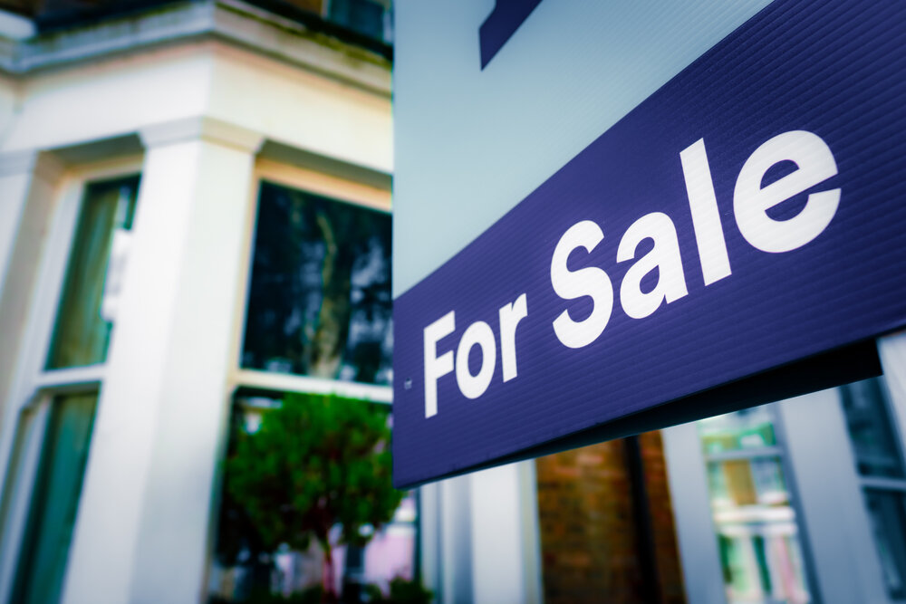 House with for sale sign