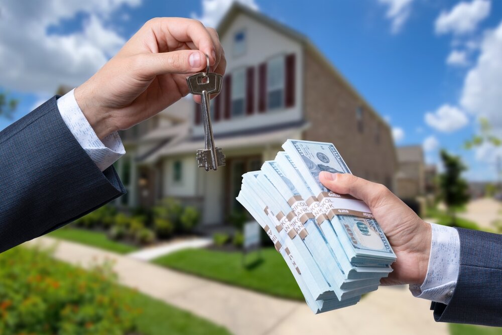 handing money to homeowner