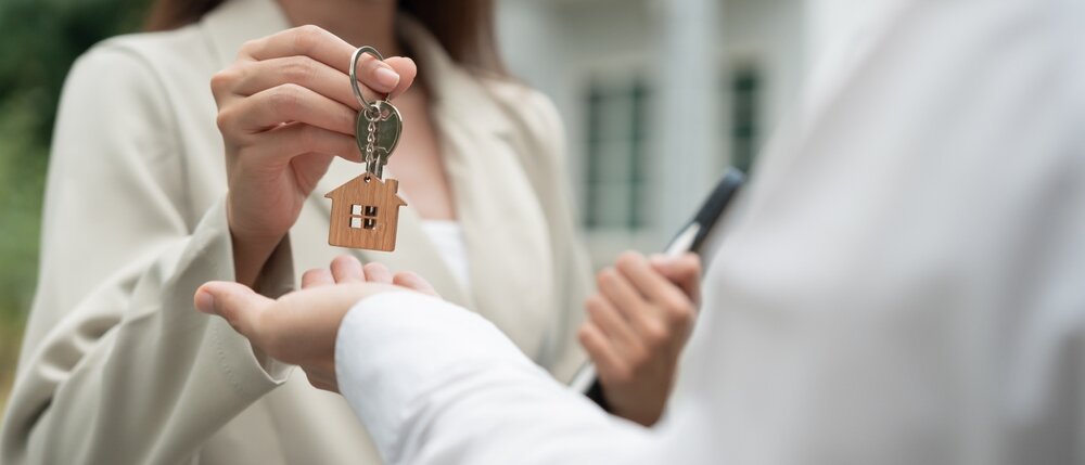 Home seller giving away the home keys
