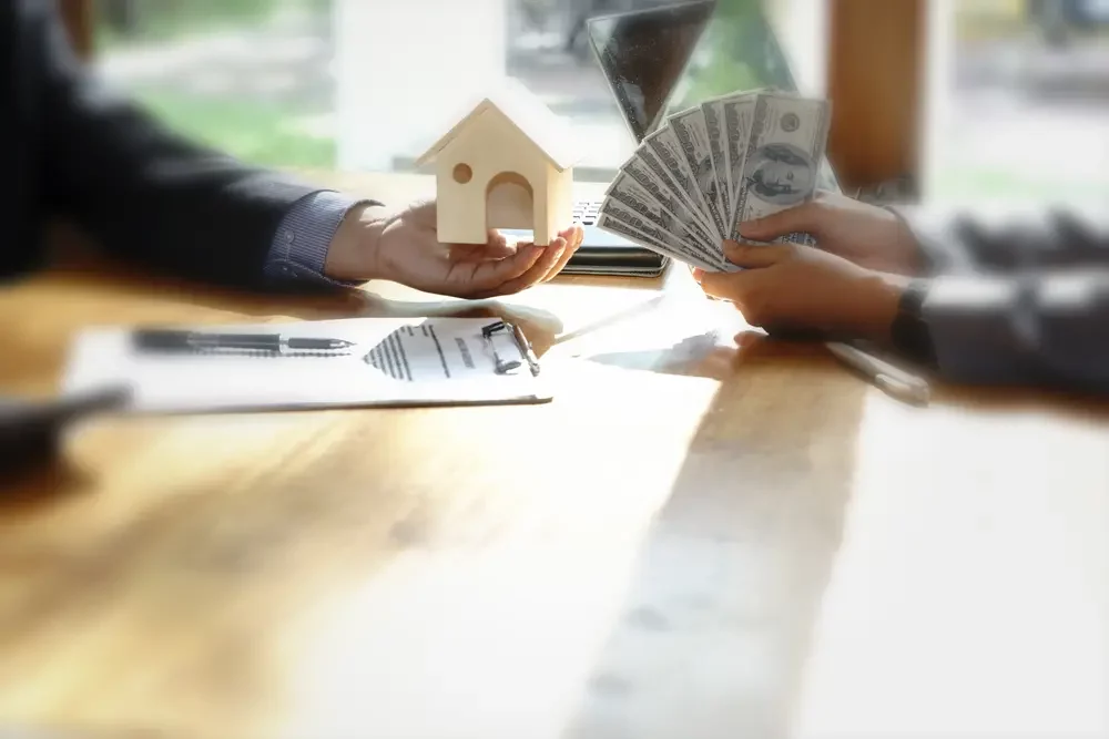 Confident homeowner reviewing a cash offer to sell their house on their terms with Southern Properties