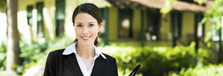 Real estate agent dressed in black recommending that you don't rush when you're hiring an agent in greenville nc