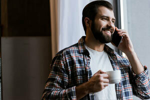 man on the phone with home buyers nc discussing the sale of his house