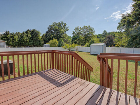 View of the spacious backyard taken from the back steps of the owner financed home at 105 Glenmont Ln, Greenville SC.