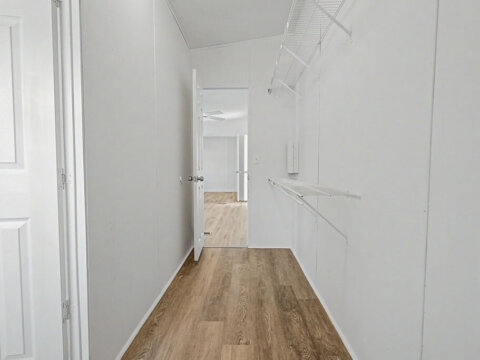 Clean interior storage closet providing extra organization space in the owner financed home at 105 Glenmont Ln.