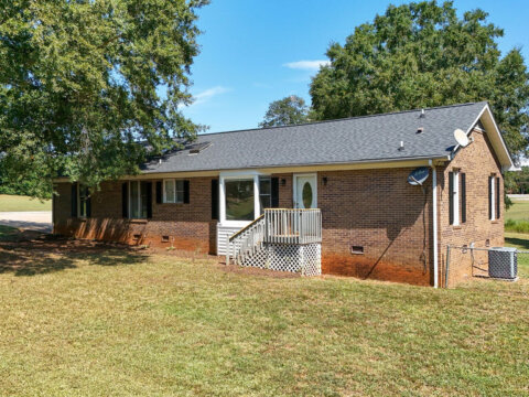 Brick ranch home for sale in Cowpens, SC with landscaped front yard