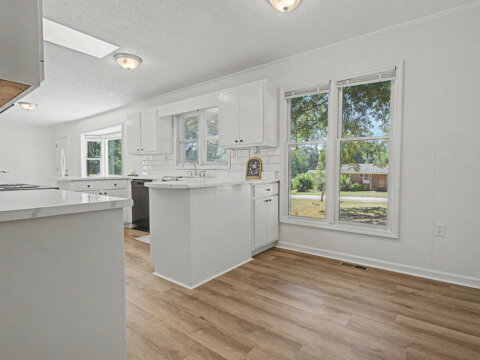 Bright kitchen with sink and window in Cowpens, SC home