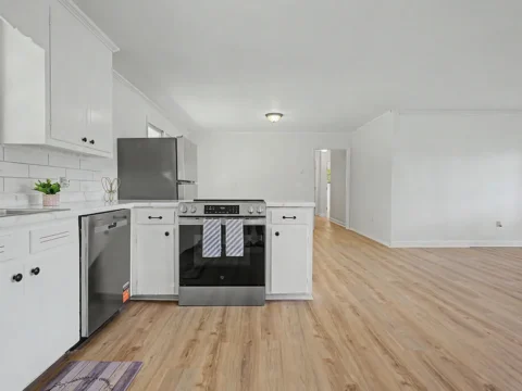 Open concept kitchen and dining room in remodeled Upstate SC home