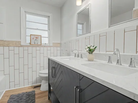 Modern bathroom with subway tile shower and dark gray vanity in Belton SC