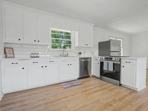 Updated kitchen with white cabinets and stainless steel appliances in Belton SC