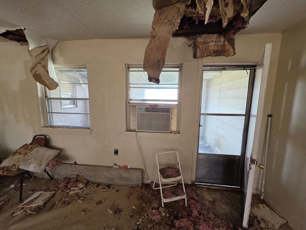 Distressed Property With Ceiling Damage In Lubbock Texas, Showing How Cash Home Buyers Make It Easy To Sell Your House Fast
