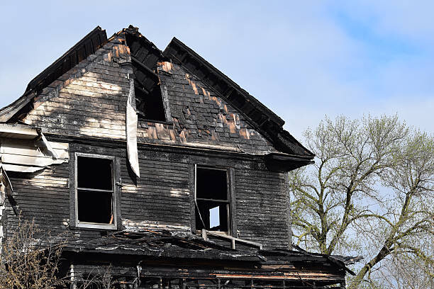 Distressed fire-damaged home with structural damage, sold as-is to a cash home buyer in Texas.