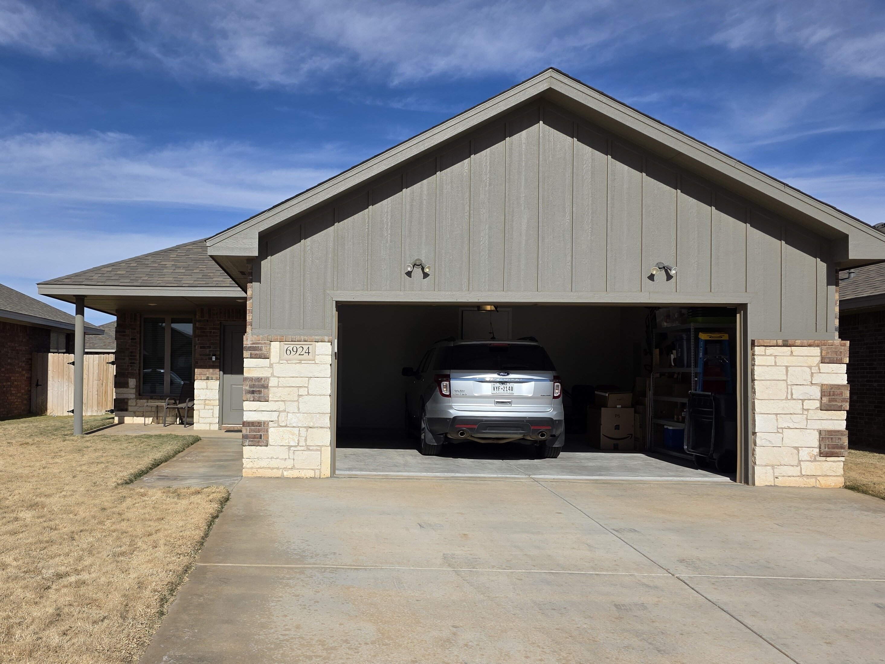 Single-story brick home with attached garage in Lubbock, Texas purchased by Electrum Properties.