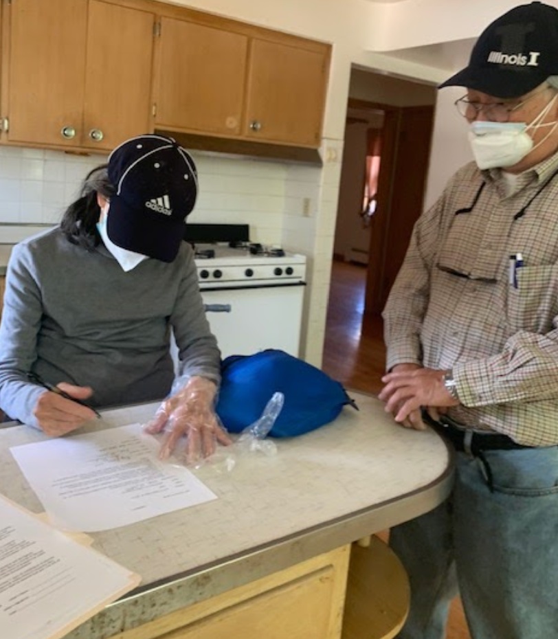 Family in Rolling Meadows signing paperwork to sell inherited house quickly for cash. Screenshot
