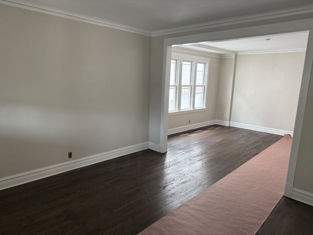 After flooring photo showing transition from the old hardwood floors to newly stained hardwood floors in Mount Prospect.