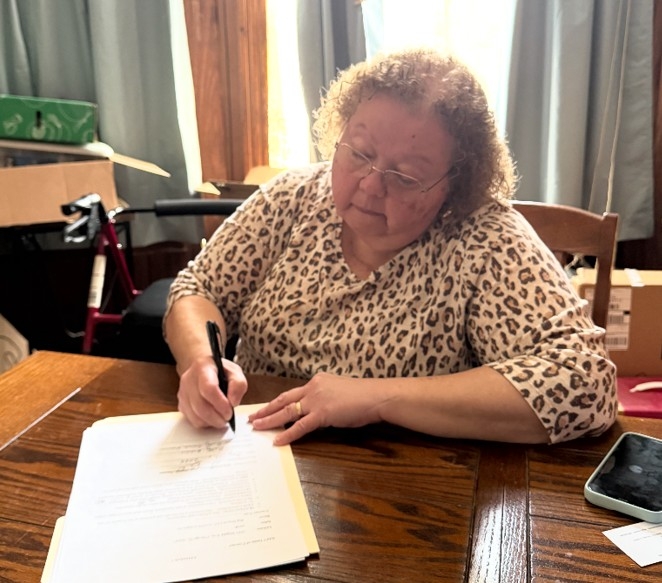 Chicago homeowner reviewing a direct home sale offer from Braddock Investment Group