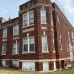 Distressed Chicago brick building purchased as-is by Braddock Investment Group