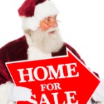 4 Disadvantages of Selling a House During the Holiday Season | santa holding sale sign