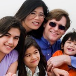 signs it might be time to sell your home | large and happy mixed family