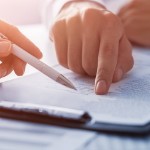 Real Estate Disclosures | pointing at paper