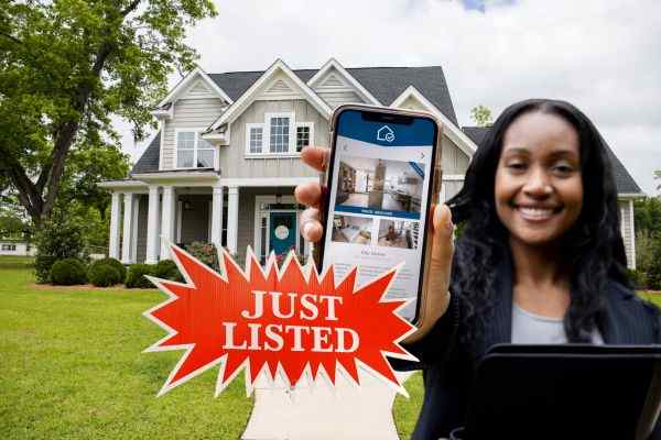 A traditional single-family home in Stockton listed with a real estate agent, showcasing curb appeal and staging.