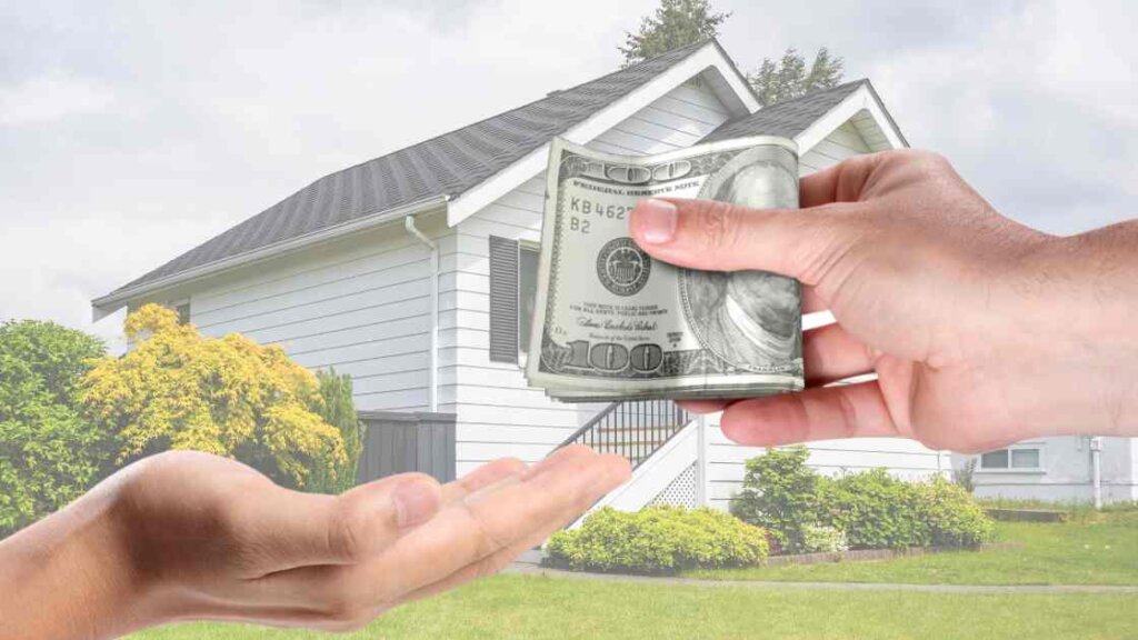 A fast cash home buyers hand passing cash to another hand