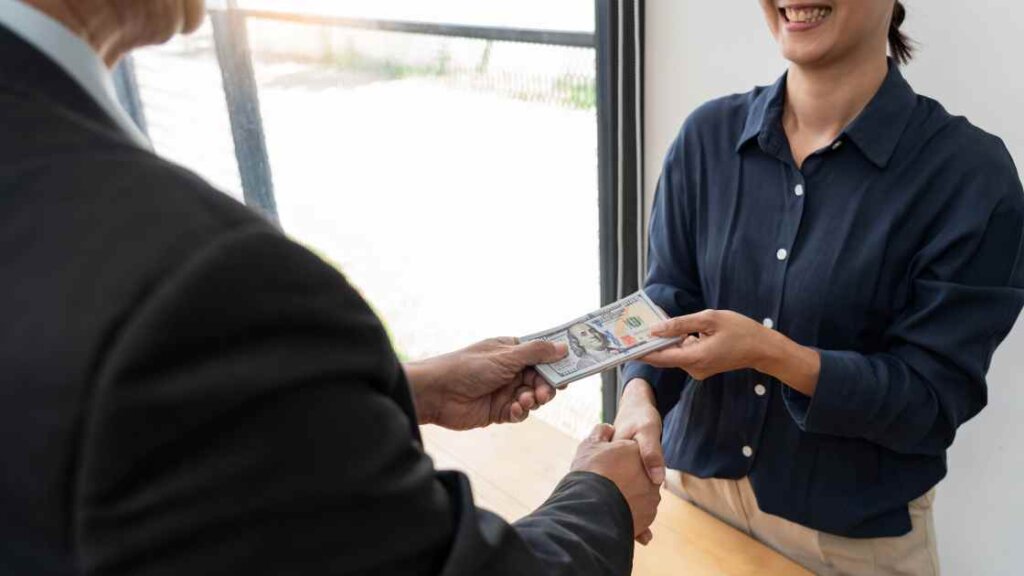 Happy homeowner receives a cash offer for their house from a quick house sale company