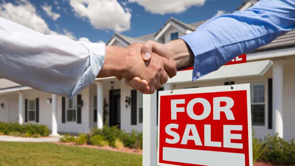 Homeowners shaking hands with a representative from a reputable quick house sale company, ensuring a reliable and legitimate transaction