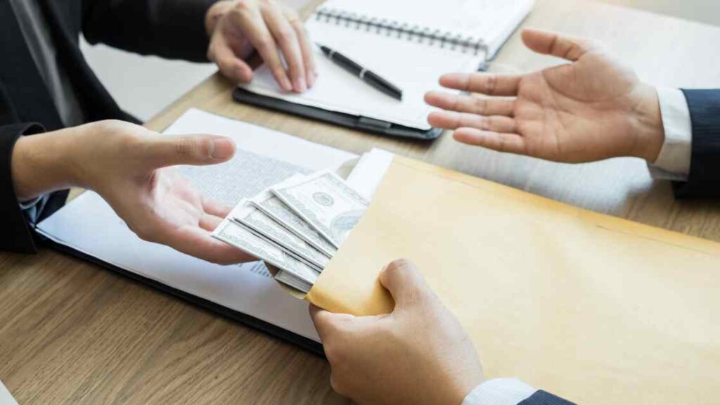 Person receiving cash from a fast cash home buyer