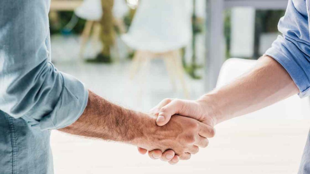 Professional handshake or person in a business suit representing the importance of professionalism