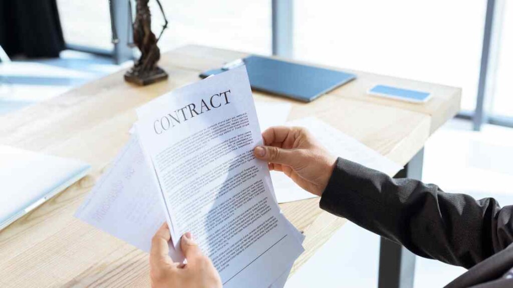 A person reading a contract, emphasizing the importance of understanding the concept of quick house sale companies.
