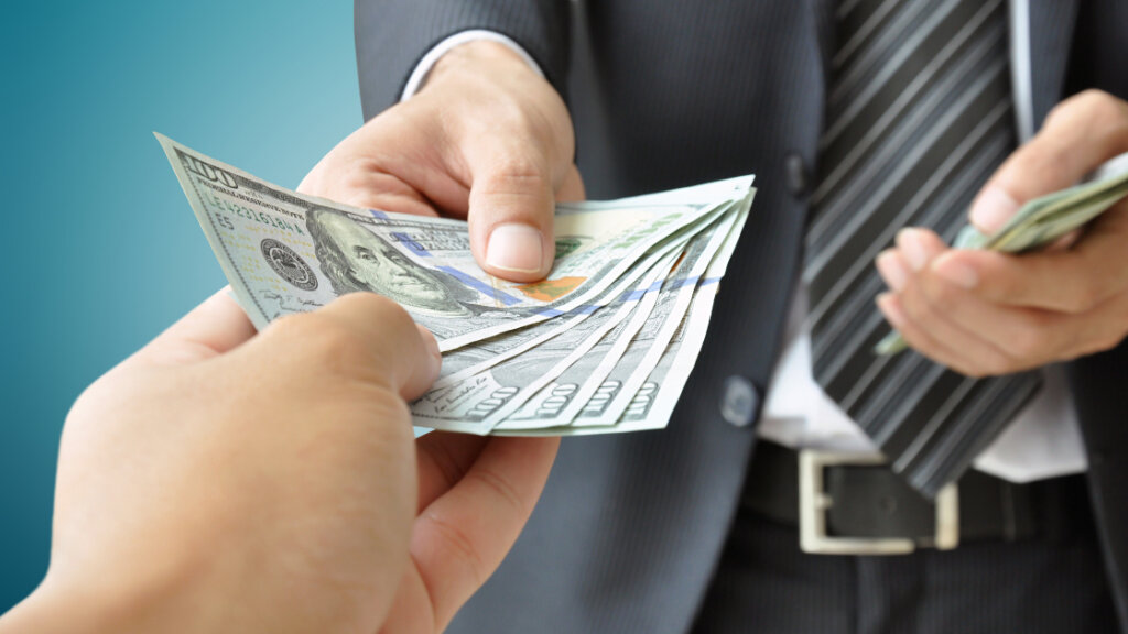 Homeowner receiving cash payment from a buyer for a water-damaged property