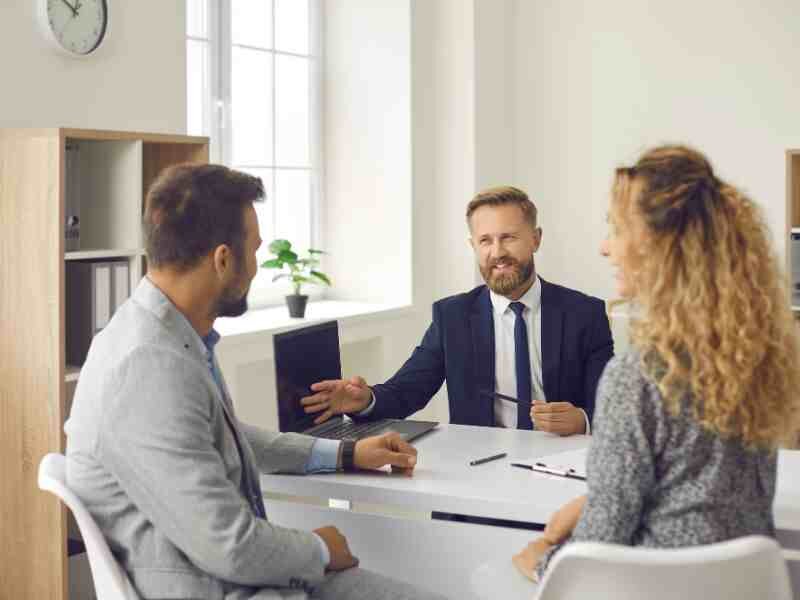 Image of a real estate attorney and inspector discussing a condemned property