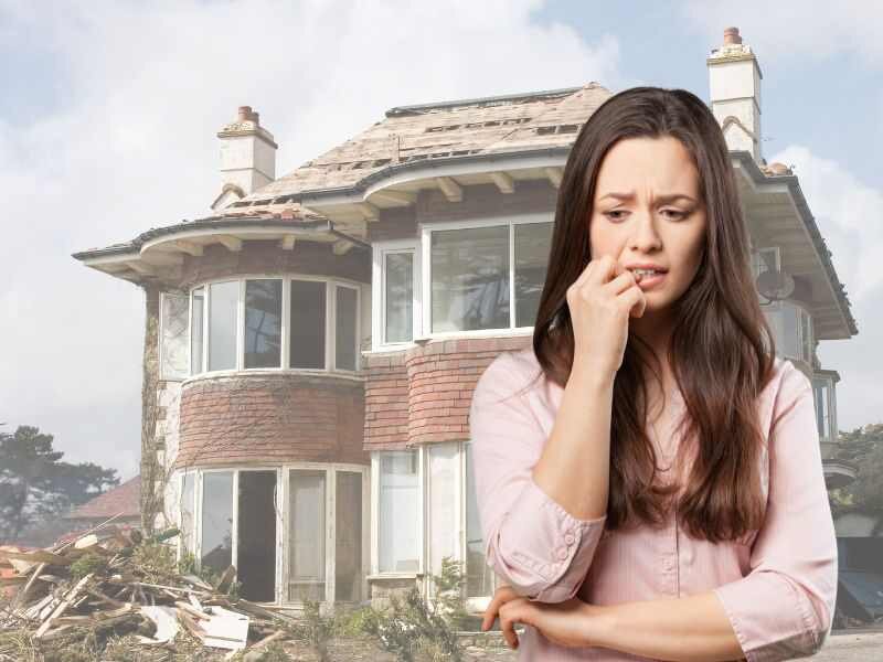 Person pondering next steps outside a condemned house in Stockton.