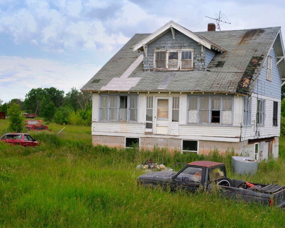 Example of a condemned house with signs of neglect and safety hazards.